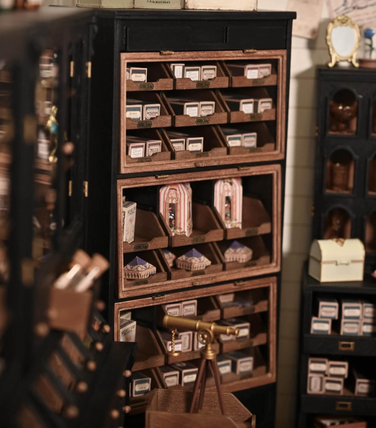 Bring vintage elegance to your dollhouse with this Miniature Edwardian Wooden Haberdashery Cabinet Kit. This beautifully crafted cabinet features 27 functional drawers, perfect for organizing tiny items or displaying your miniature collection. With its timeless Edwardian design and intricate detailing, it’s an ideal addition to any miniature shop, office, or apothecary scene.