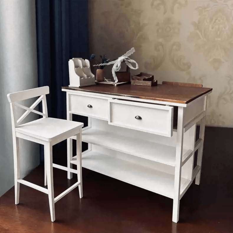 Add both style and function to your dollhouse with this Miniature Kitchen Island Table with Drawers and Shelves Kit. This beautifully crafted kitchen island table features a charming two-tone wood design, functional drawers, and open shelves, providing plenty of storage and display space for your miniature kitchen items. Whether you’re organizing or showcasing your tiny accessories, this table brings practicality and elegance to your miniature home.