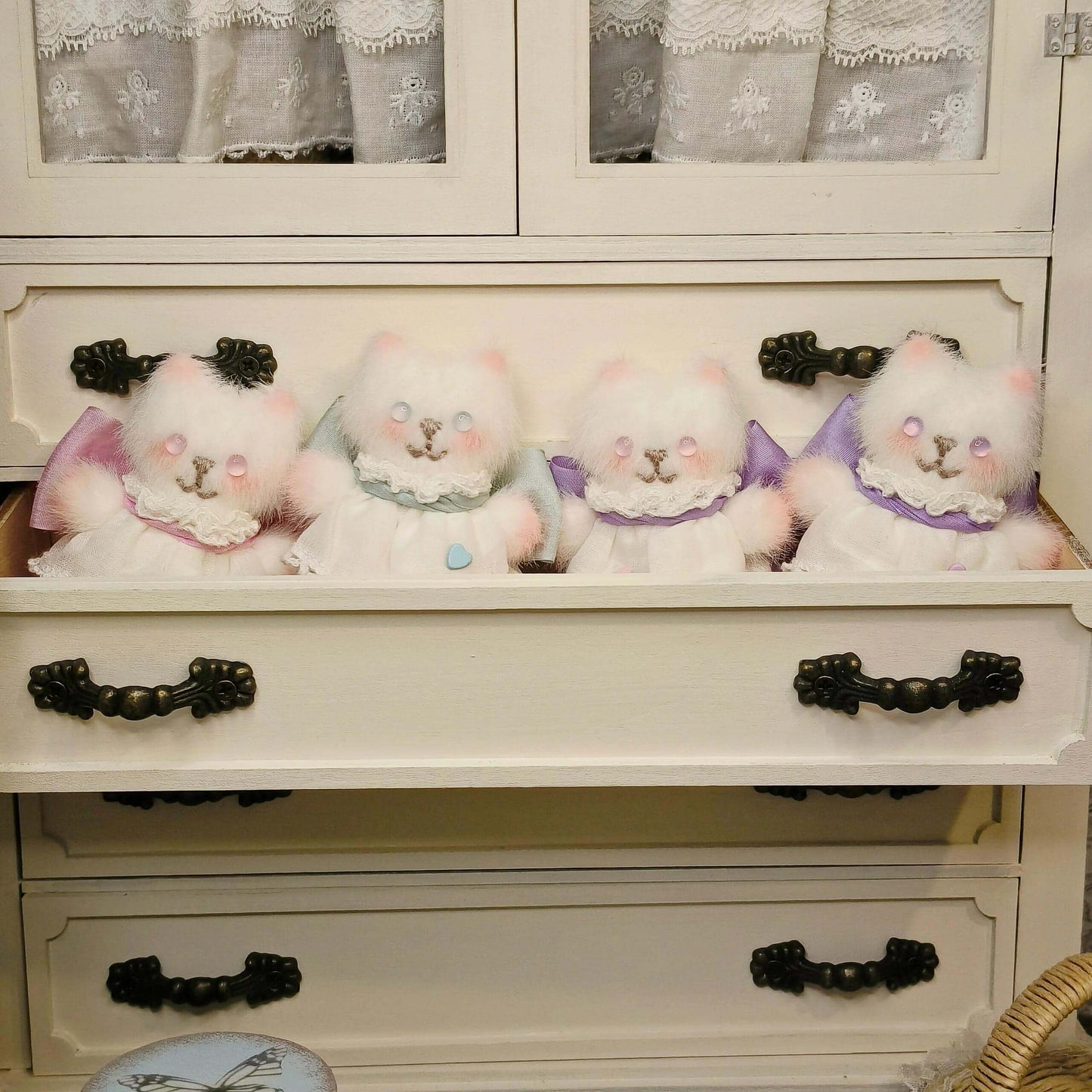 Add a vintage touch to your dollhouse kitchen with this Miniature Vintage Kitchen Cabinet Carved Cupboard with Doors and Drawers. This beautifully crafted cabinet features intricate carvings, doors for concealed storage, and drawers for organizing small items. The charming design and detailed craftsmanship make it a perfect addition to any miniature kitchen, offering both functionality and style.