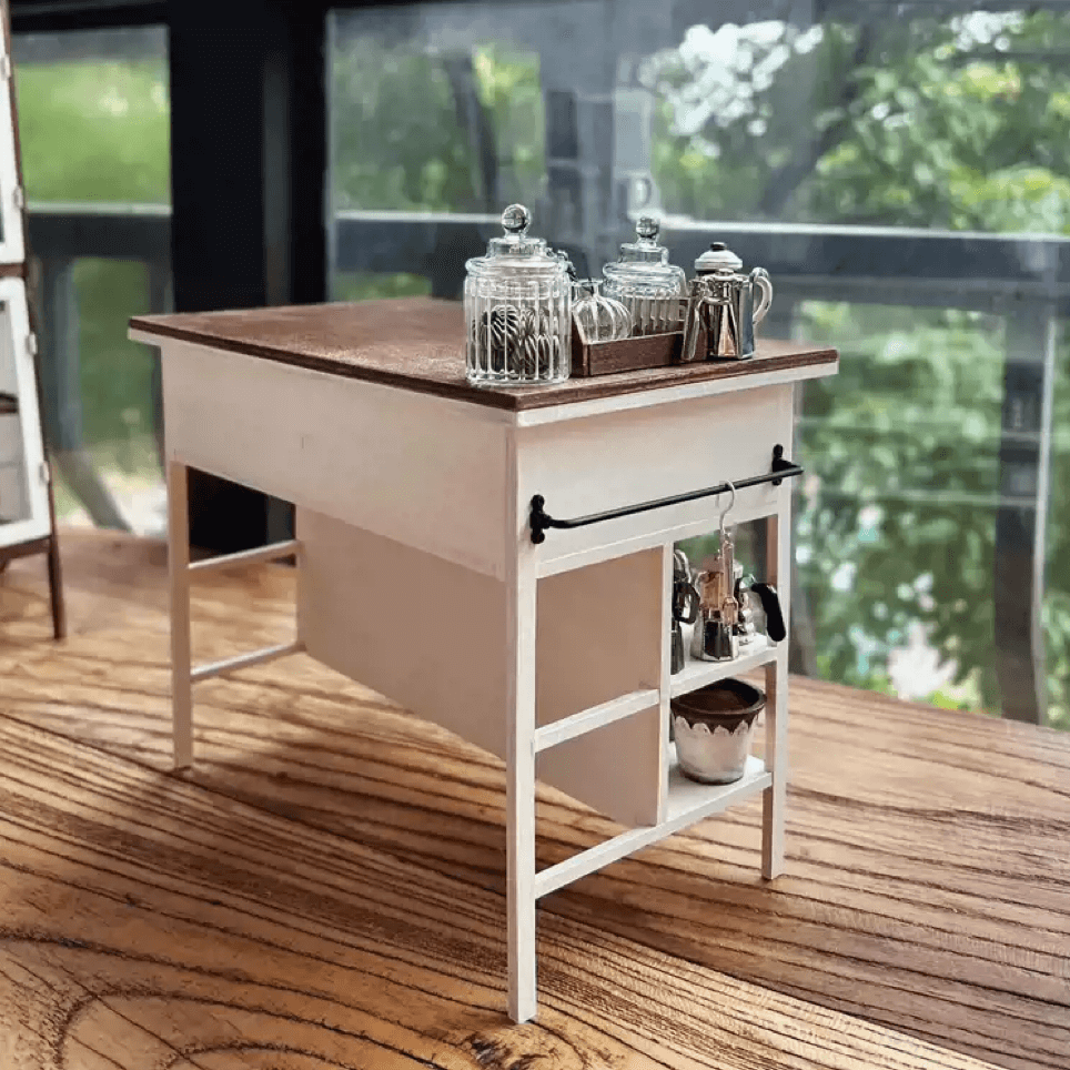 Add both style and function to your dollhouse with this Miniature Kitchen Island Table with Drawers and Shelves Kit. This beautifully crafted kitchen island table features a charming two-tone wood design, functional drawers, and open shelves, providing plenty of storage and display space for your miniature kitchen items. Whether you’re organizing or showcasing your tiny accessories, this table brings practicality and elegance to your miniature home.