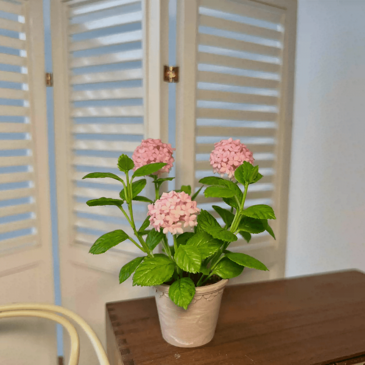 Hydrangeas are deciduous shrubs with flowers in terminal, round or umbrella-shaped clusters in colors of white, pink, or blue, or even purple. Dollhouse Garden Plants Handmade from Clay.