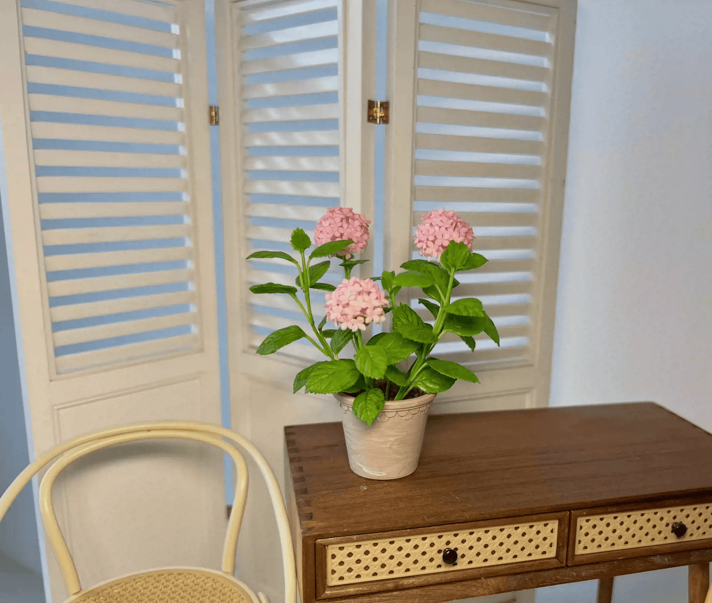 Hydrangeas are deciduous shrubs with flowers in terminal, round or umbrella-shaped clusters in colors of white, pink, or blue, or even purple. Dollhouse Garden Plants Handmade from Clay.