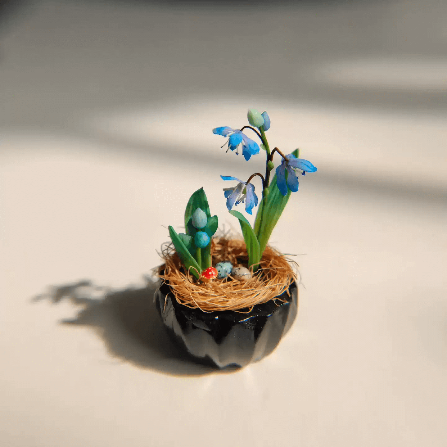 Siberian Squill (Scilla siberica) produces multiple flowers per stem, in the most beautiful deep blue color. Mushroom, Bird's eggs and Siberian Squill (Scilla siberica) in Gypsum pot.  Material: Handmade from Clay