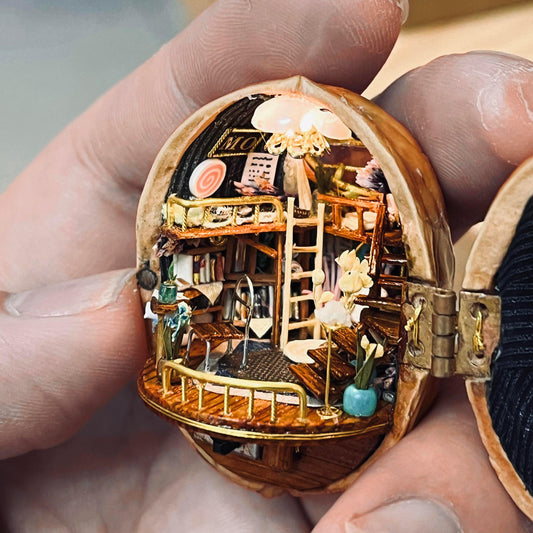 This Melody Magic House is entirely handmade; the items inside and the windows can all be opened and closed.