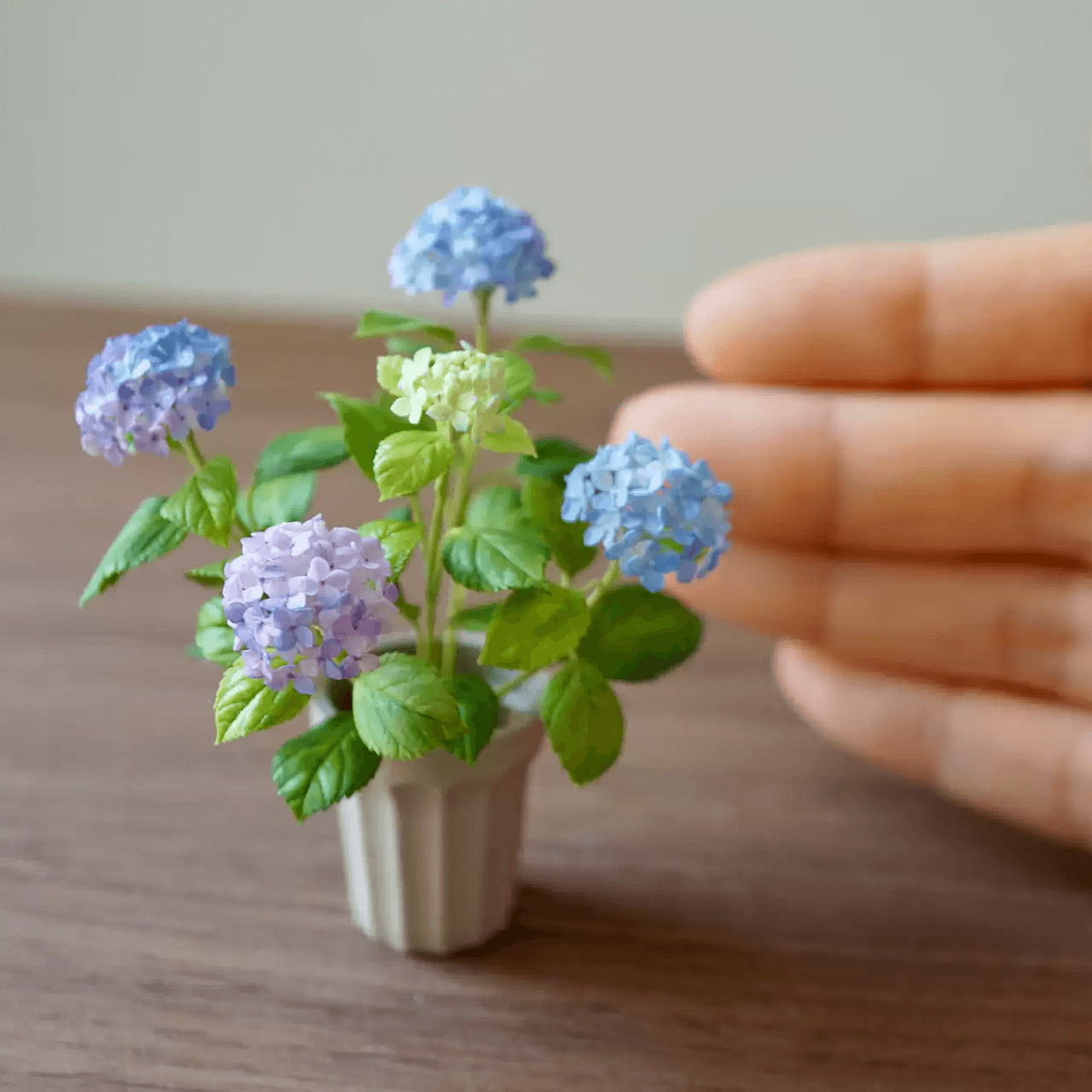 Hydrangeas are deciduous shrubs with flowers in terminal, round or umbrella-shaped clusters in colors of white, pink, or blue, or even purple.  Dollhouse Garden Plants Handmade from Clay.