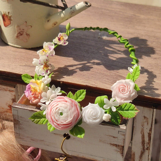 Glamorous accessory designed to elevate Blythe, Barbie, Paola,and other dolls with effortless elegance. Crafted to adorn your dolls with cascading garlands of intricate floral details, this headband adds a touch of enchantment to any dollhouse. Material: Handmade from Clay