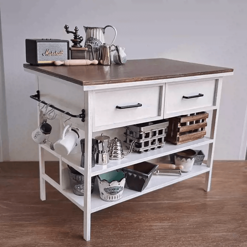 This Miniature Kitchen Island Table will look wonderful inside any room of your dollhouse, perfect for a cottage country look, or just to be exposed in your real house.  Default Color/ Finish: White and Brown Material: Solid Wood Type: Kitchen Island Table Scale: 1/6 (20×12×15.5cm / 7.87×4.72×6.10in)