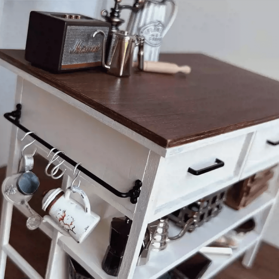 This Miniature Kitchen Island Table will look wonderful inside any room of your dollhouse, perfect for a cottage country look, or just to be exposed in your real house.  Default Color/ Finish: White and Brown Material: Solid Wood Type: Kitchen Island Table Scale: 1/6 (20×12×15.5cm / 7.87×4.72×6.10in)