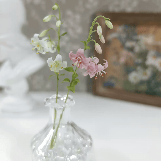 Lilium martagon, commonly known as the Martagon Lily or Turk's Cap Lily, is a captivating and elegant perennial plant native to Europe and Asia.  Scale: 1:6; 1:12  Material: Handmade from Clay  Size: 3 flowers + 4 buds  Default Color: White or Pink