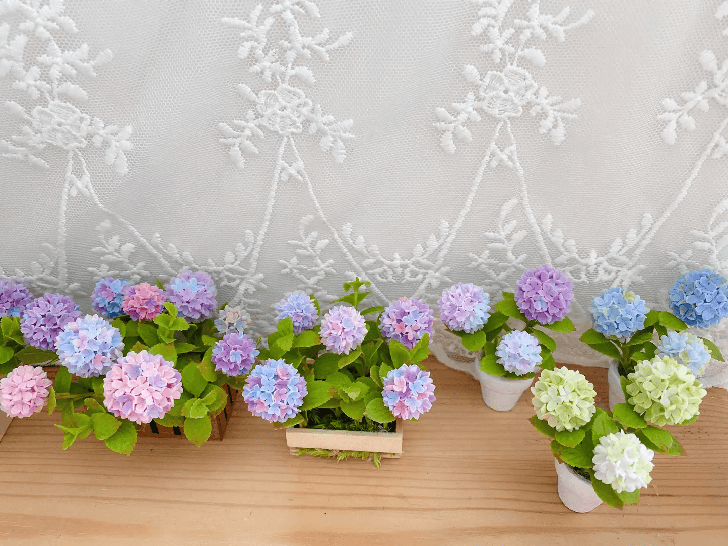 Hydrangeas are deciduous shrubs with flowers in terminal, round or umbrella-shaped clusters in colors of white, pink, or blue, or even purple.  Dollhouse Garden Plants Handmade from Clay.