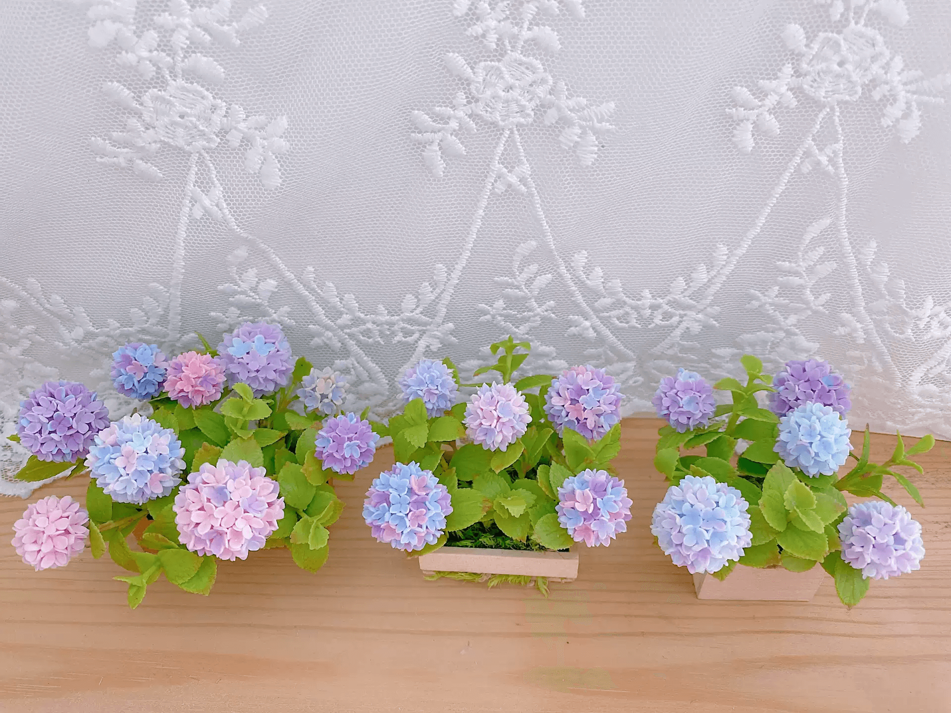 Hydrangeas are deciduous shrubs with flowers in terminal, round or umbrella-shaped clusters in colors of white, pink, or blue, or even purple.  Dollhouse Garden Plants Handmade from Clay.