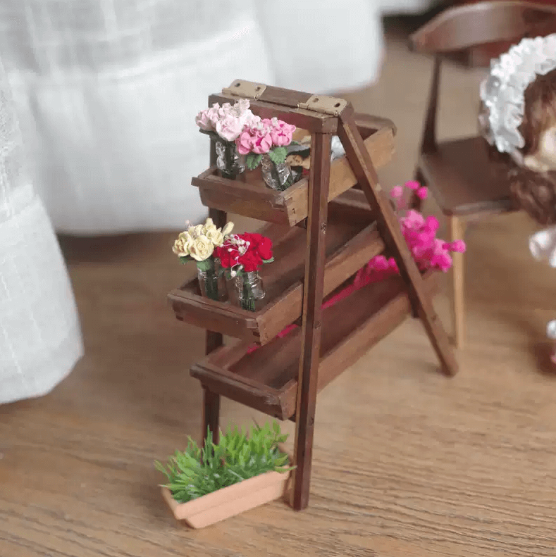 Miniature rustic walnut A-frame shelving unit with removeable trays. Perfect for dollhouse and garden use as a display stand for ornaments or flower and plants. Perfect for a moern or more traditional home decor look.