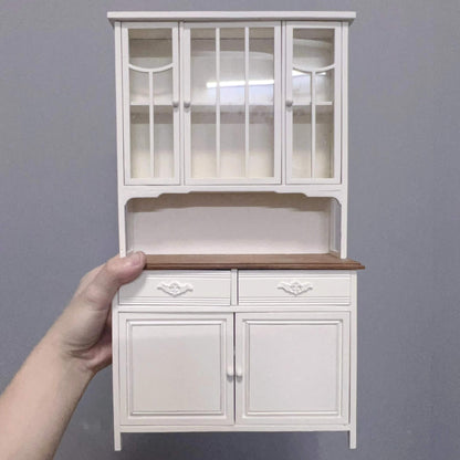 Elegantly appointed, the White Kitchen Dresser is a fantastic way to add plenty of extra storage space to any 1/6 scale dollhouse kitchen or dining room. Color/ Finish: White Styles: French styling Material: Solid Wood Type: Kitchen Dresser, Kitchen Cabinet. Miniature Furniture for 1/6 scale dolls, dollhouse, Kitchen.