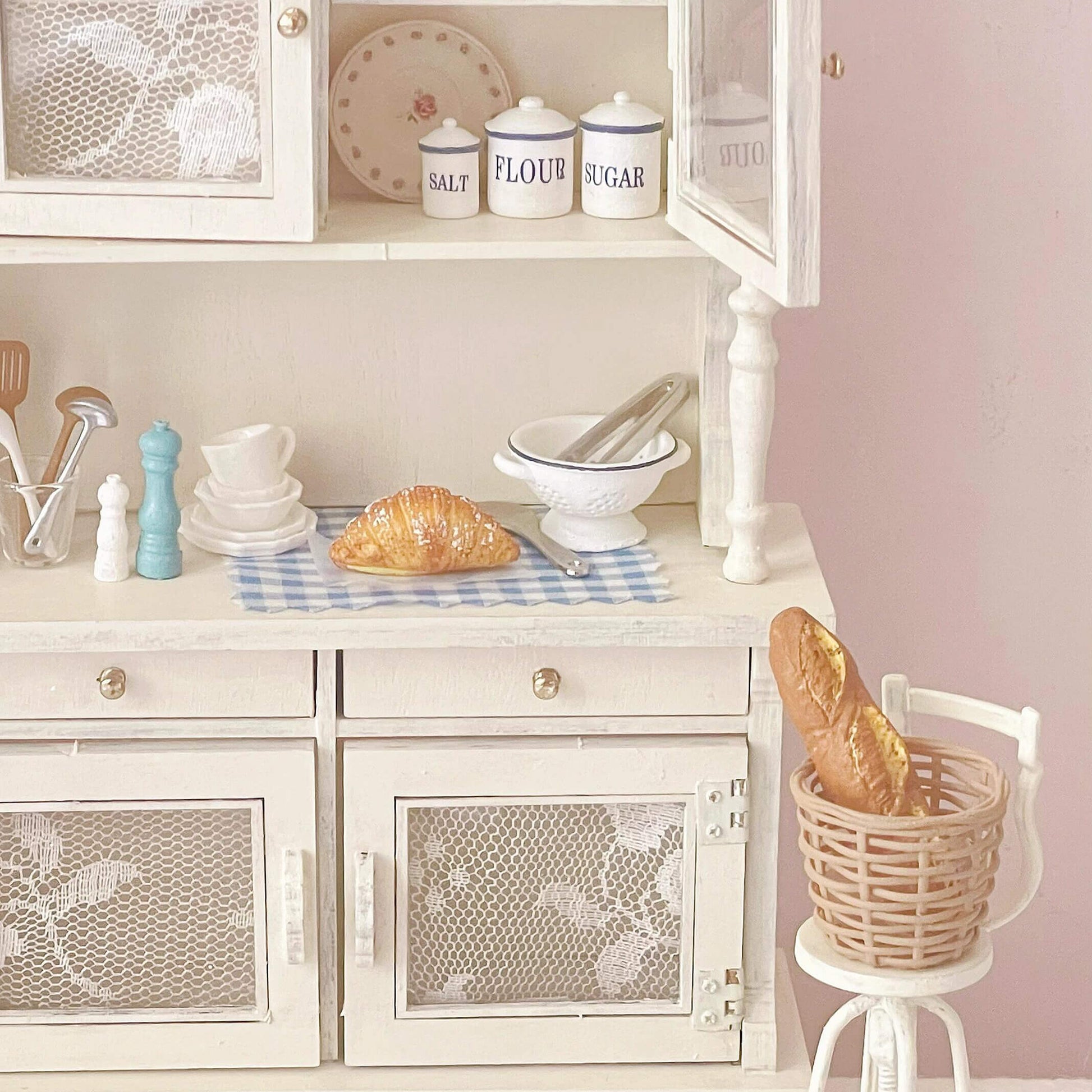 Add a touch of vintage elegance to your dollhouse with this Miniature Shabby Chic Kitchen Sideboard Cupboard Dresser Cabinet Kit. This beautifully crafted piece combines a charming sideboard with a cupboard and dresser, offering both display and storage options. The cabinet features doors for showcasing small items, while the lower section includes drawers for organizing your mini treasures.