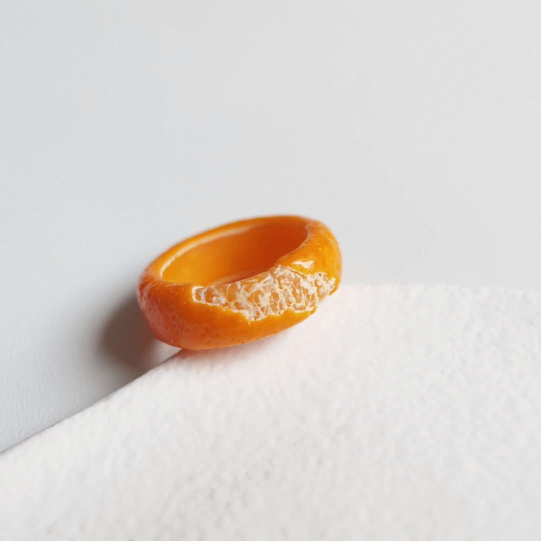 Cute realistic tangerine half-peeled ring are made with sterling silver or gold plated and polymer clay and then finished with a gloss varnish. The ring are made from high-quality materials and are durable, but should not be put in aggressive environments like excessive moisture, chemicals or perfume.