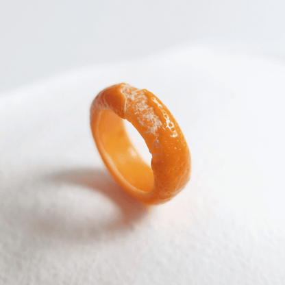 Cute realistic tangerine half-peeled ring are made with sterling silver or gold plated and polymer clay and then finished with a gloss varnish. The ring are made from high-quality materials and are durable, but should not be put in aggressive environments like excessive moisture, chemicals or perfume.