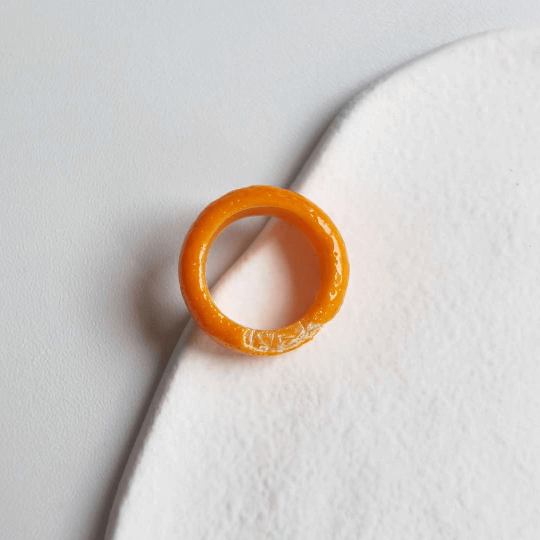 Cute realistic tangerine half-peeled ring are made with sterling silver or gold plated and polymer clay and then finished with a gloss varnish. The ring are made from high-quality materials and are durable, but should not be put in aggressive environments like excessive moisture, chemicals or perfume.