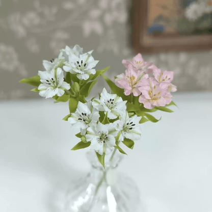 Alstroemeria, also commonly called the Peruvian Lily of the Incas, is the flower of happiness.  Scale: 1:6; 1:12  Material: Handmade from Clay  Size: 4 flowers + 1 bud  Color: White; Pink; Yellow