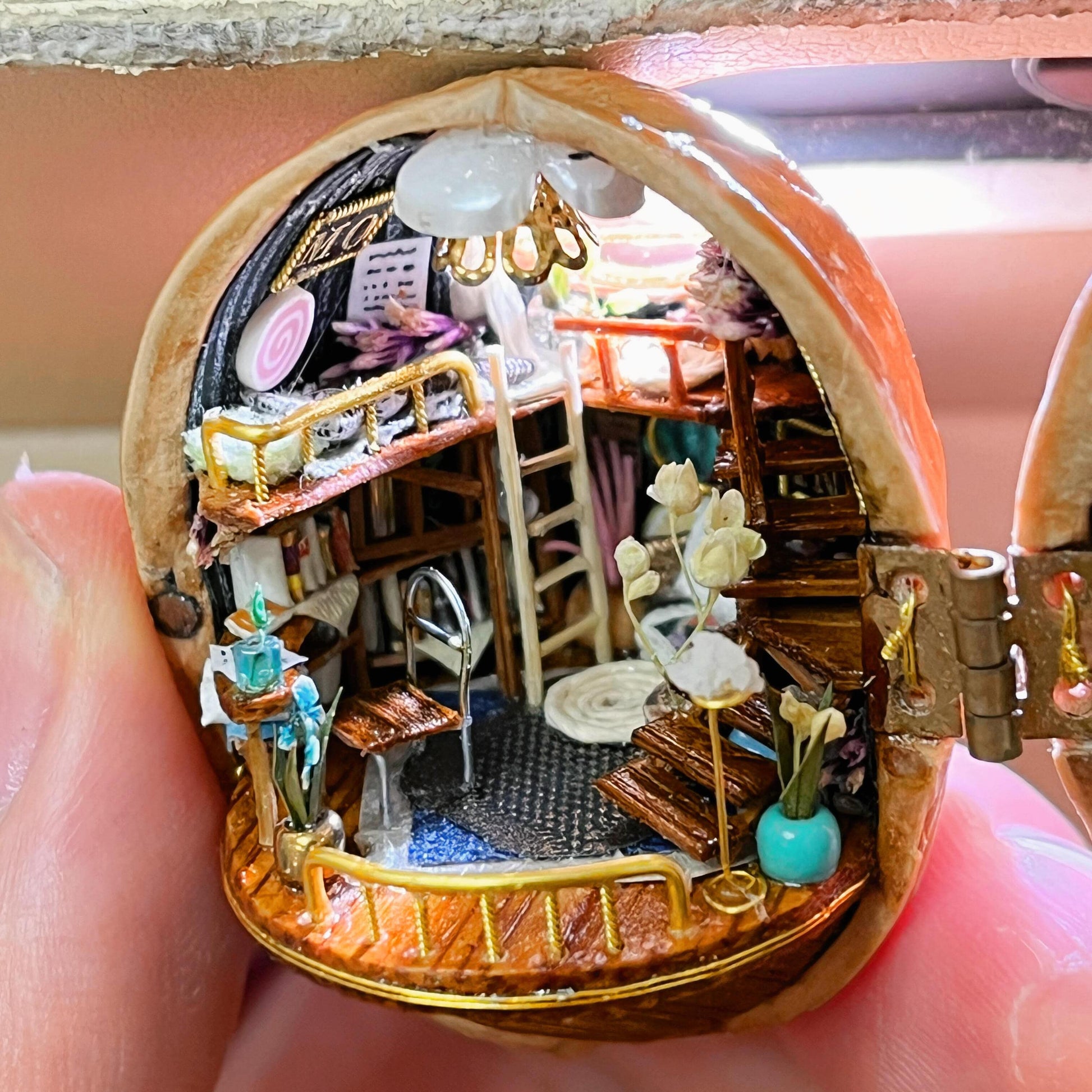 This Melody Magic House is entirely handmade; the items inside and the windows can all be opened and closed.