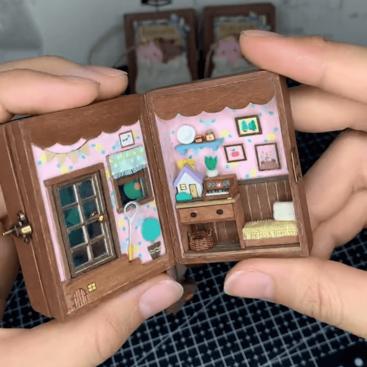 This flip book diorama showcases a beautifully crafted miniature scene featuring BB Bear's cozy home, presented in a flip book-style diorama. As the pages turn, the viewer is transported into a tiny, charming world where BB Bear lives. The intricate details of the miniature house, furnishings, and surroundings create a warm, inviting atmosphere.