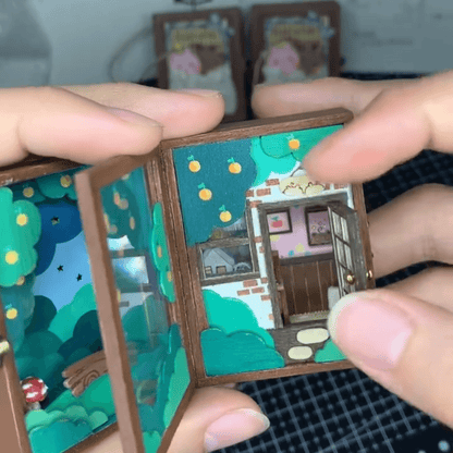 This flip book diorama showcases a beautifully crafted miniature scene featuring BB Bear's cozy home, presented in a flip book-style diorama. As the pages turn, the viewer is transported into a tiny, charming world where BB Bear lives. The intricate details of the miniature house, furnishings, and surroundings create a warm, inviting atmosphere.