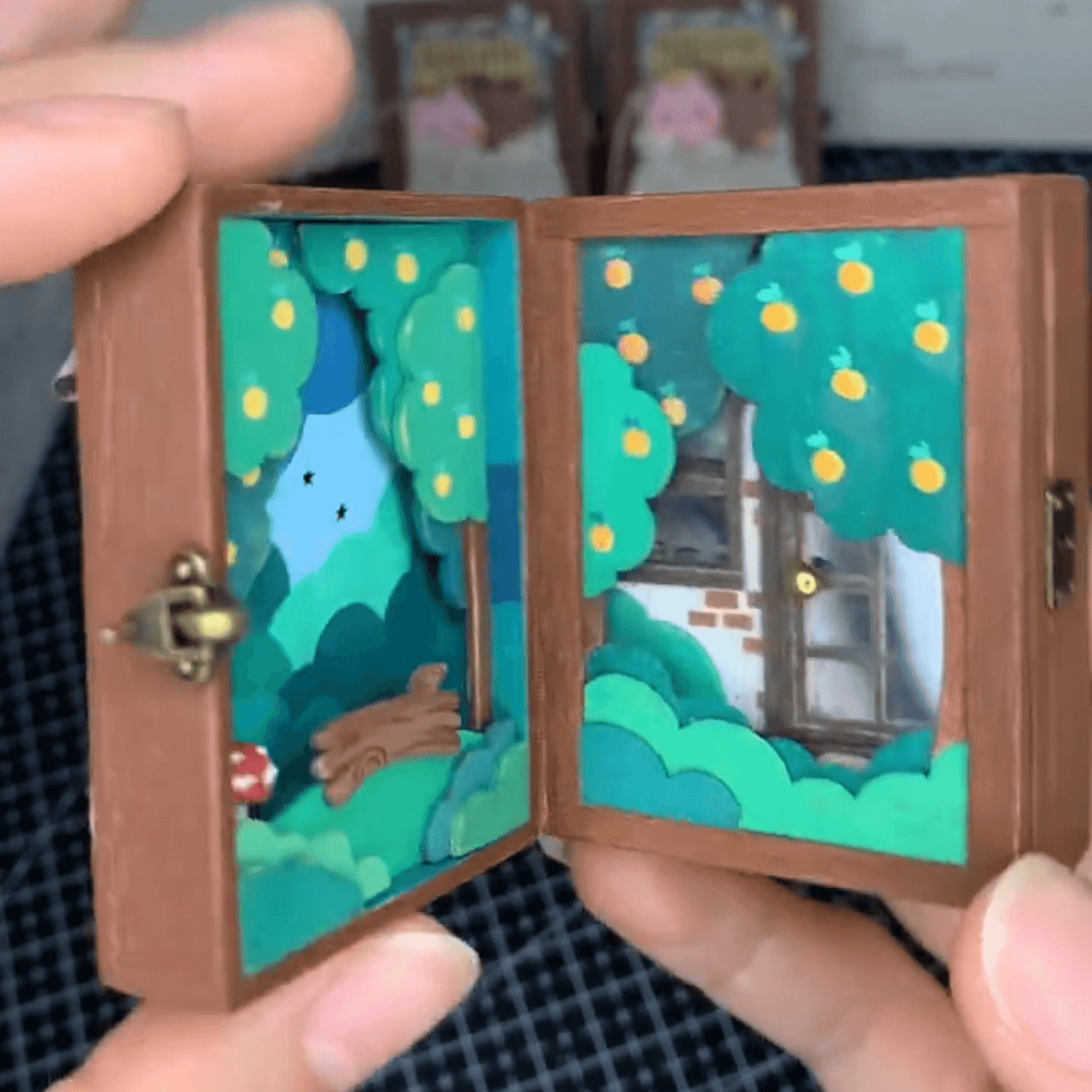 This flip book diorama showcases a beautifully crafted miniature scene featuring BB Bear's cozy home, presented in a flip book-style diorama. As the pages turn, the viewer is transported into a tiny, charming world where BB Bear lives. The intricate details of the miniature house, furnishings, and surroundings create a warm, inviting atmosphere.