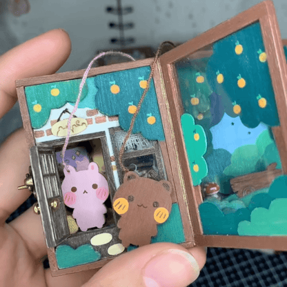 This flip book diorama showcases a delicate miniature scene of Bunny Kani's home, presented in a flip book-style diorama within a tiny craft world. The visuals are intricate and creative, with each page turn revealing a unique little world, as if drawing the viewer into Bunny Kani's cozy home.