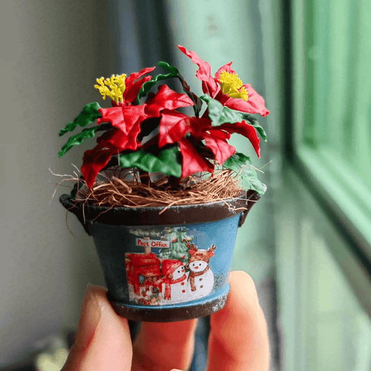 Poinsettia (Euphorbia pulcherrima) is a classic holiday plant, known for its festive red bracts set against green leaves.  This miniature Christmas Flower Euphorbia pulcherrima (Poinsettia)  ornaments will look stunning on a table setting or dollhouse.  Material: Handmade from Clay