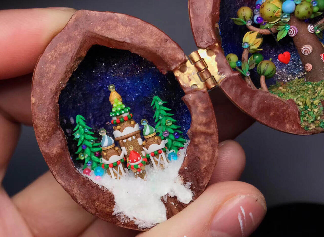 This enchanting miniature scene, set inside a walnut shell, depicts a festive christmas winter wonderland. Colorful ornaments, miniature snowdrifts, and delicate details like the Christmas tree on the castle create a magical holiday atmosphere. Perfect as a keepsake or holiday decoration, this miniature walnut shell diorama captures the essence of Christmas in a unique, handcrafted style.