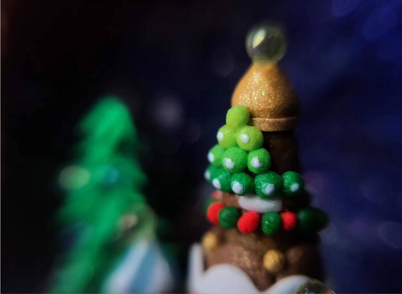 This enchanting miniature scene, set inside a walnut shell, depicts a festive christmas winter wonderland. Colorful ornaments, miniature snowdrifts, and delicate details like the Christmas tree on the castle create a magical holiday atmosphere. Perfect as a keepsake or holiday decoration, this miniature walnut shell diorama captures the essence of Christmas in a unique, handcrafted style.