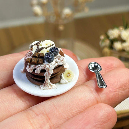 Handmade, each piece is unique! The real thing is super beautiful and cute. Perfect for decorating dollhouses of all sizes! Size: 2cm / 0.79in This set includes a miniature banana and blueberry pancake, a miniature ceramic plate, and a random fork or spoon.