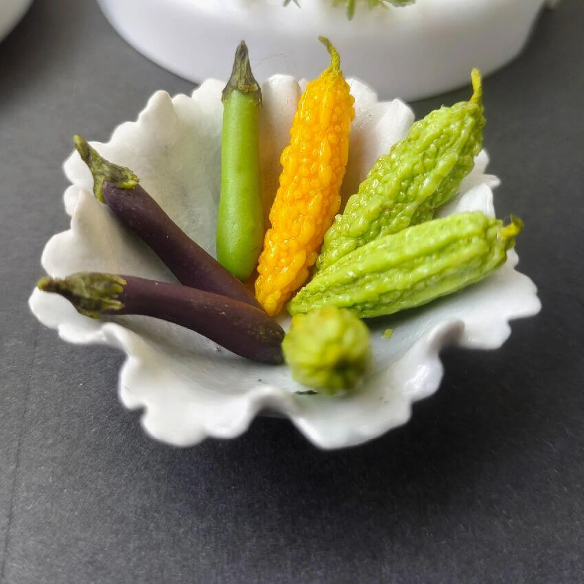 This miniature vegetable bitter melon / bitter gourd would be a wonderful addition to any doll's house kitchen or dining room table. Material: Clay