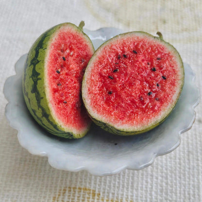 Enhance your dollhouse with these meticulously crafted miniature watermelons. These miniature watermelons are made with attention to detail, ensuring durability and a lifelike appearance. The intricate details and vibrant colors make them stand out as realistic and attractive dollhouse food items. Material: Clay