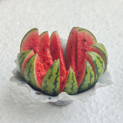 Enhance your dollhouse with these meticulously crafted miniature watermelons. These miniature watermelons are made with attention to detail, ensuring durability and a lifelike appearance. The intricate details and vibrant colors make them stand out as realistic and attractive dollhouse food items. Material: Clay