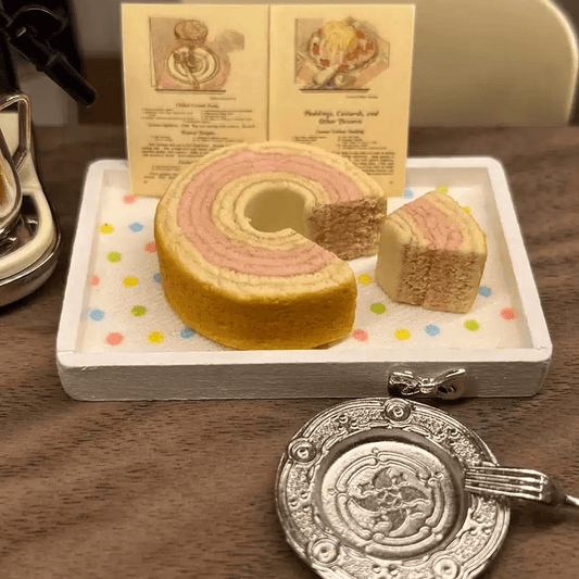 This listing is for x1 Miniature Strawberry Baumkuchen German Tree Cake. There are x1 Slices that have been cut from the Tree Cake.