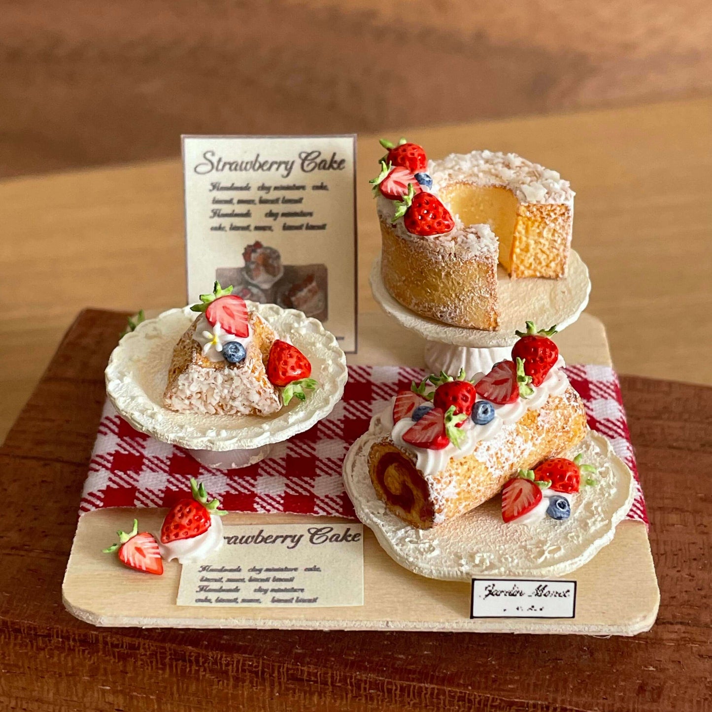 Indulge in our Miniature Strawberry Cake Set, a delightful addition to your dollhouse or miniature scene. All featuring a charming strawberry theme. Each piece is carefully made with high-quality materials to ensure realistic details and long-lasting beauty.