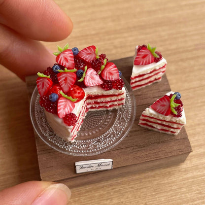 Indulge in our Strawberry and Berry Cake Set, a delightful addition to your dollhouse or miniature scene. All featuring a charming strawberry and berry theme. Each piece is carefully made with high-quality materials to ensure realistic details and long-lasting beauty.