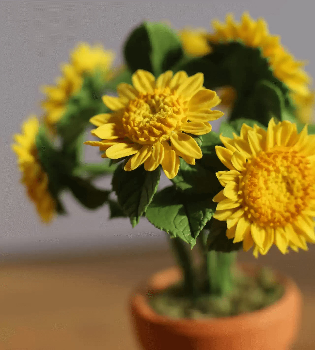 Helianthus annuus is a dwarf growing annual sunflower with large, double golden-yellow flowers, it's an excellent cut flower.  Material: Handmade from Clay