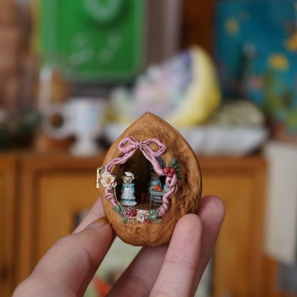 Step into a magical miniature world where a bear serves as the charming waiter in a cozy restaurant built inside a walnut shell. Nestled inside a hollow walnut shell, this tiny restaurant bursts with cozy details: a warm dining area, intricate furniture, and tiny meals served with love. This unique creation blends creativity and craftsmanship to bring a whimsical story to life in the tiniest of spaces.