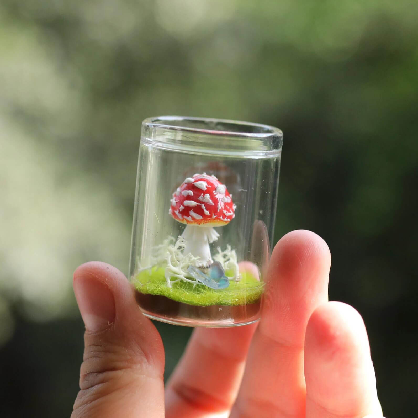 Bring a touch of magic to your space with our adorable Miniature Mushroom nestled in a charming glass jar! This enchanting piece creating a serene atmosphere perfect for any dollhouse room or garden.