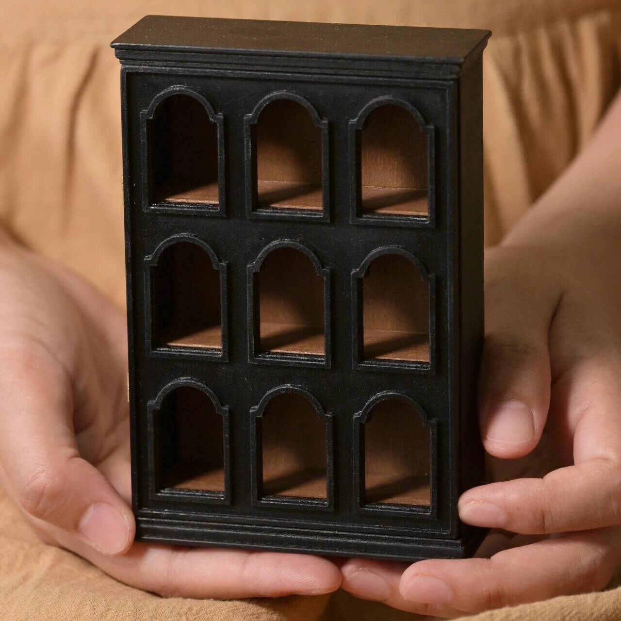 Whether you want to display your favorite figurines, trophies, or valuable items, this Miniature Display Shelf Cabinet with Door is perfect for various collections. It adds a touch of sophistication to your dollhouse store, living room, bedroom, or office.