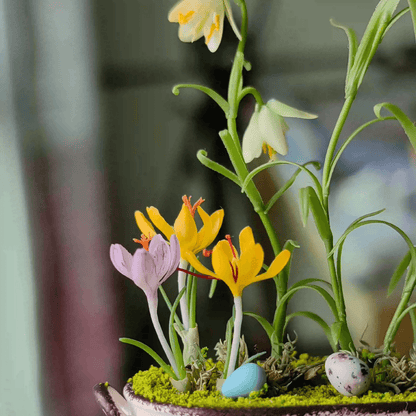 Fritillarias flower from mid to late spring and are perennial.  Crocus is a wonderful bulb to plant underneath trees or in a landscape bed.  Fritillaria thunbergii, Fritillaria meleagris, Crocus sativus and bird's eggs in clay planter.  Material: Handmade from Clay