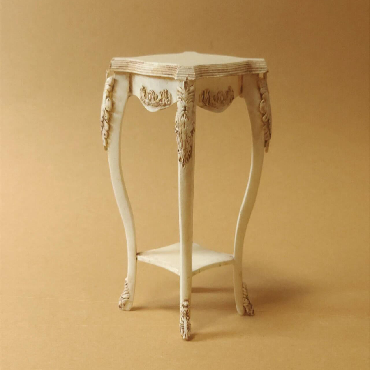 This Miniature Artisan Flower Stand Plant Shelf Side Table Kit for Dollhouses is a versatile and elegant addition to any dollhouse setting. Designed with intricate carvings and gracefully curved legs, this piece serves as a charming flower stand, a practical plant shelf, or a stylish side table. Its timeless vintage aesthetic makes it ideal for dollhouse living rooms, gardens, patios, or entryways.