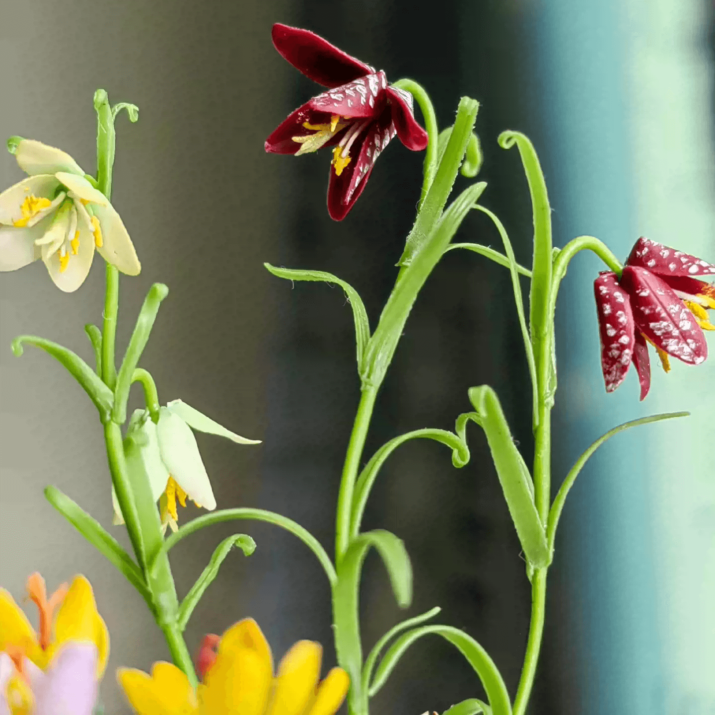 Fritillarias flower from mid to late spring and are perennial.  Crocus is a wonderful bulb to plant underneath trees or in a landscape bed.  Fritillaria thunbergii, Fritillaria meleagris, Crocus sativus and bird's eggs in clay planter.  Material: Handmade from Clay