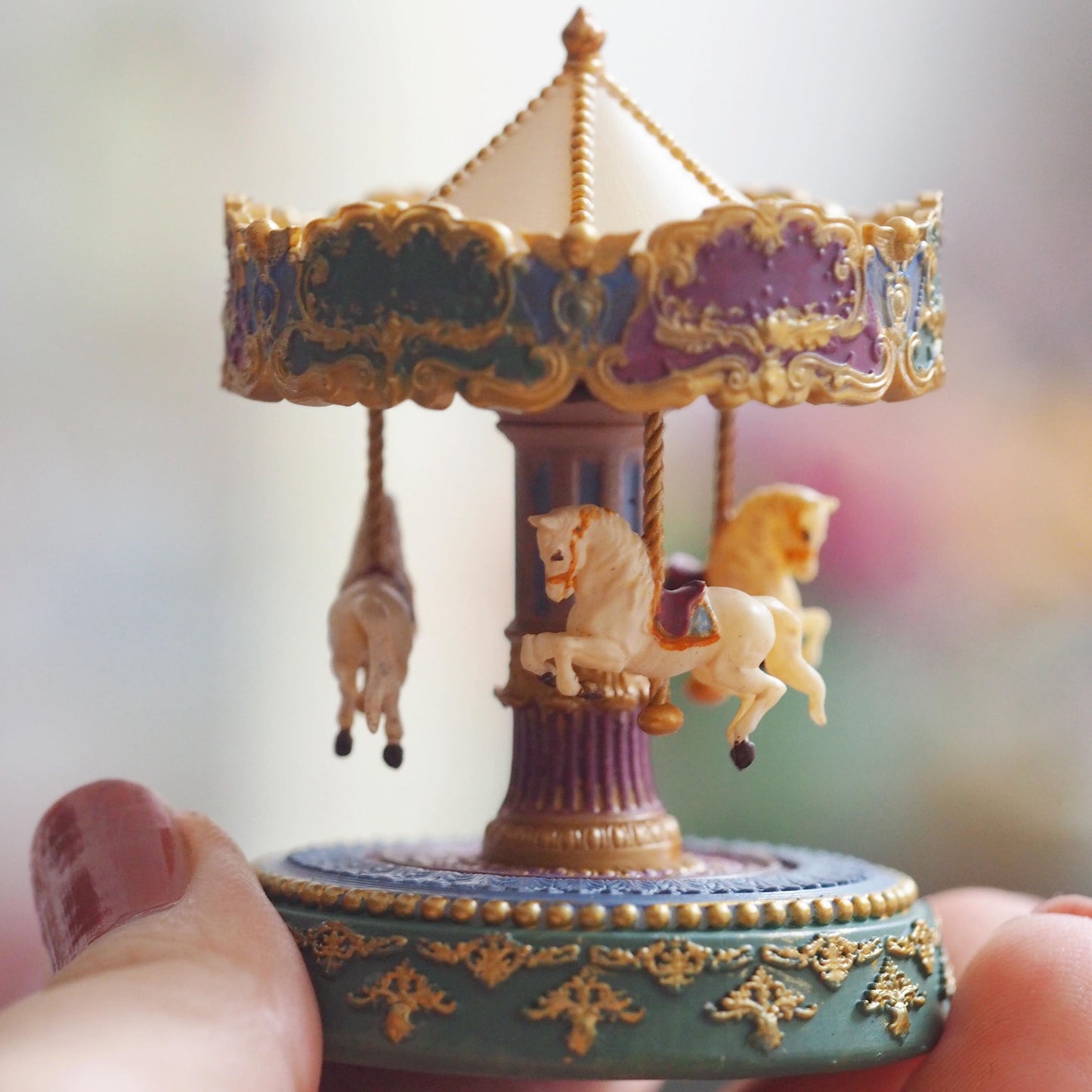 Add a touch of nostalgia to your dollhouse with this vintage-style miniature carousel with beautiful horses. Its vibrant colours and traditional style will be a striking and eye-catching addition to any dollhouse. Height: 6cm / 2.36inches