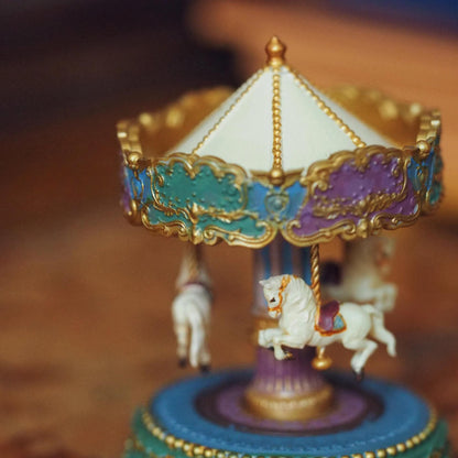 Add a touch of nostalgia to your dollhouse with this vintage-style miniature carousel with beautiful horses. Its vibrant colours and traditional style will be a striking and eye-catching addition to any dollhouse. Height: 6cm / 2.36inches