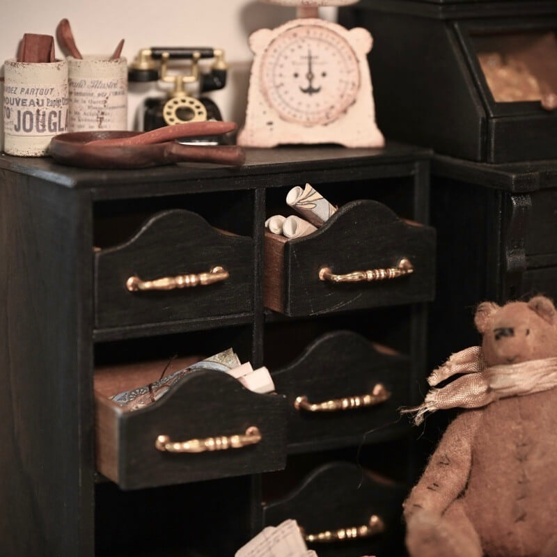 Keep your trinkets, documents, teas, dried herbs, jewellery or haberdashery organised in our dollhouse multifunctional hand painted chest. Made from wood, our chest features handy clips to keep the drawers in place when in use. Default Color/ Finish: Black and Brown Style: Shabby Chic Material: Wood