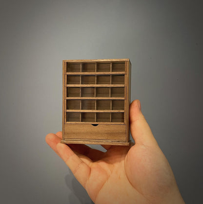 Spool cabinets are charming and functional pieces of antique furniture that were once used to store sewing thread spools. Default Color/ Finish: Cherry wood or Dark walnut Material: Black Walnut wood or Cherry wood Scale: 1/12 (4.1×1.7×5cm / 1.61×0.67×1.97in); 1/6 (7×2.7×8.2cm / 2.76×1.06×3.23in).