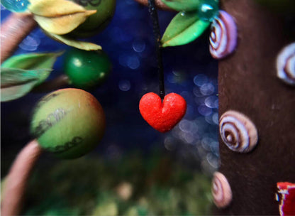 This enchanting miniature scene, set inside a walnut shell, depicts a festive christmas winter wonderland. Colorful ornaments, miniature snowdrifts, and delicate details like the Christmas tree on the castle create a magical holiday atmosphere. Perfect as a keepsake or holiday decoration, this miniature walnut shell diorama captures the essence of Christmas in a unique, handcrafted style.