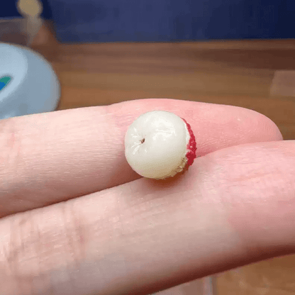 This miniature fruit lychee would be a wonderful addition to any doll's house kitchen or dining room table. Material: Clay Size: 0.8cm / 0.32in